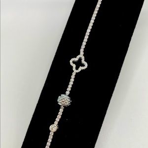 Sterling Silver bracelet with crystals and a crystal bubble cross.